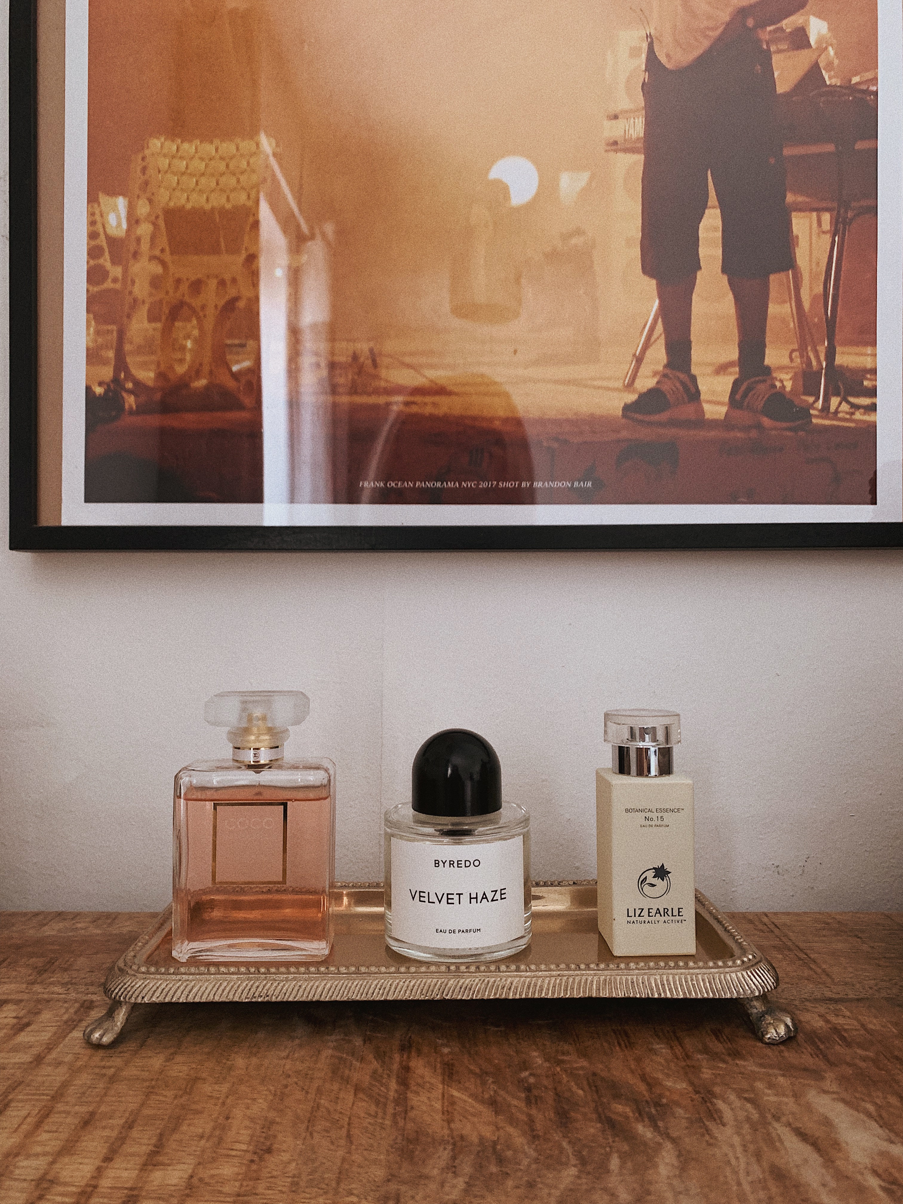 Perfumes on a gold tray - Chanel, Byredo and Liz Earle